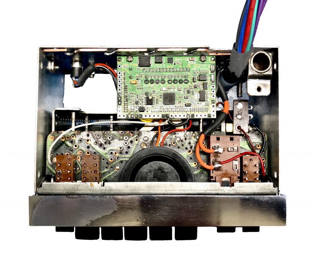 The Continental Edison R43 radio internal view from above with original electronics removed and an Aurora FMR-2.7 upgrade fitted